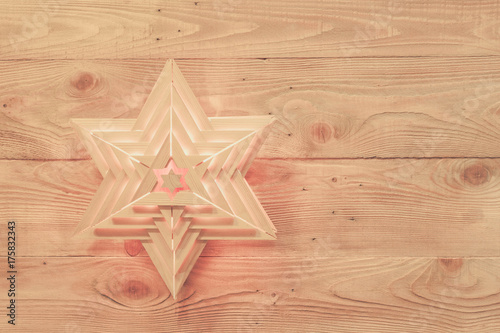 Wooden star lights on old wooden rustic background. Christmas, holiday, halloween bakground. Copy space