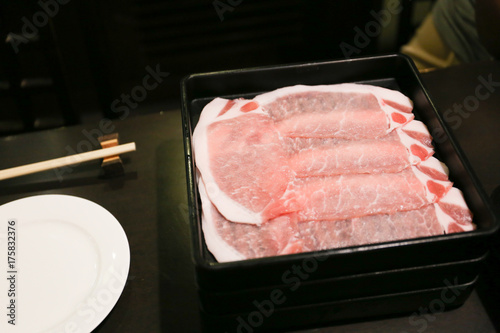 raw sliced meat on black plate, Japanese style