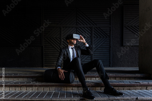 afro businessman playing virtual reality simulation