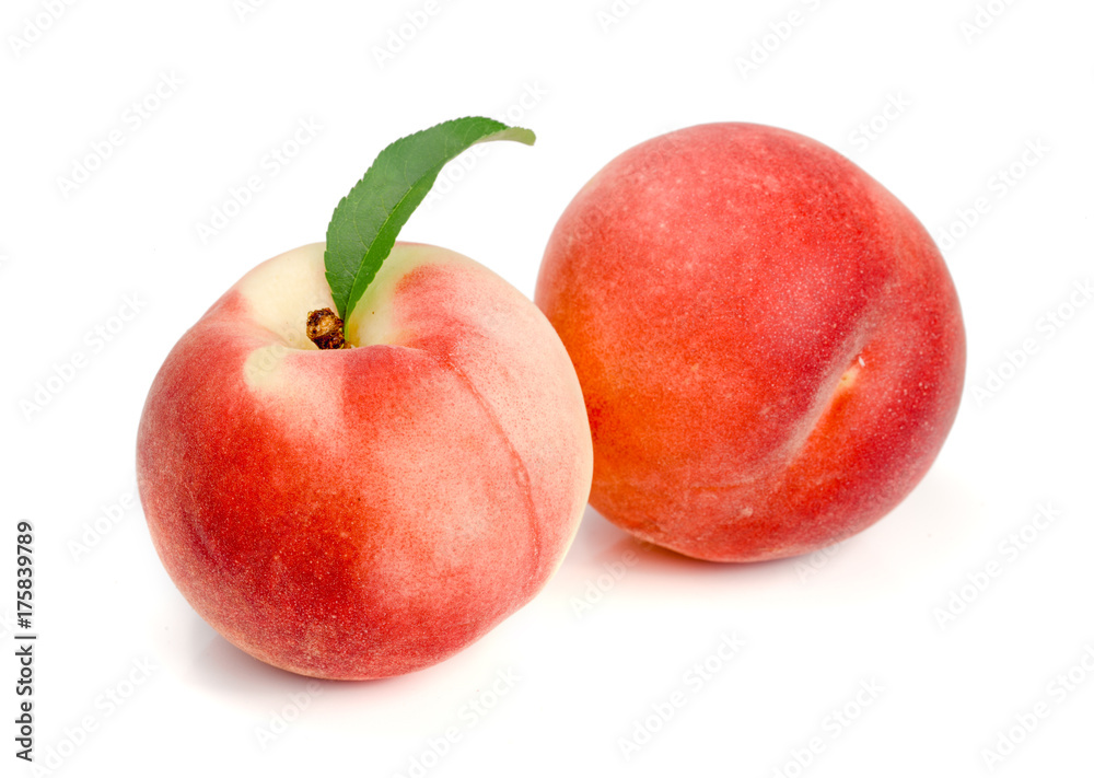 Two peaches with green leaf isolated on white background Two peaches with green leaf isolated on white background