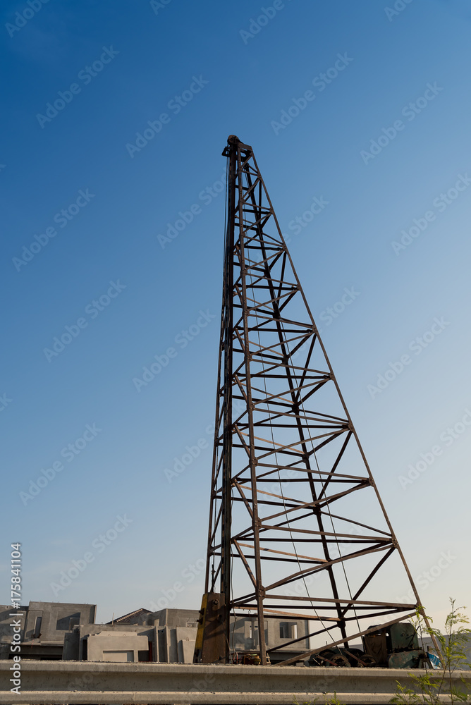 Pile driving machine in construction site