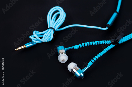 blue earphone and cable line like zipper