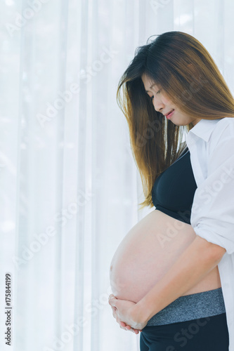 Beautiful pregnant woman touching care her belly Free Download Beautiful pregnant woman touching care her belly - GFXLoad