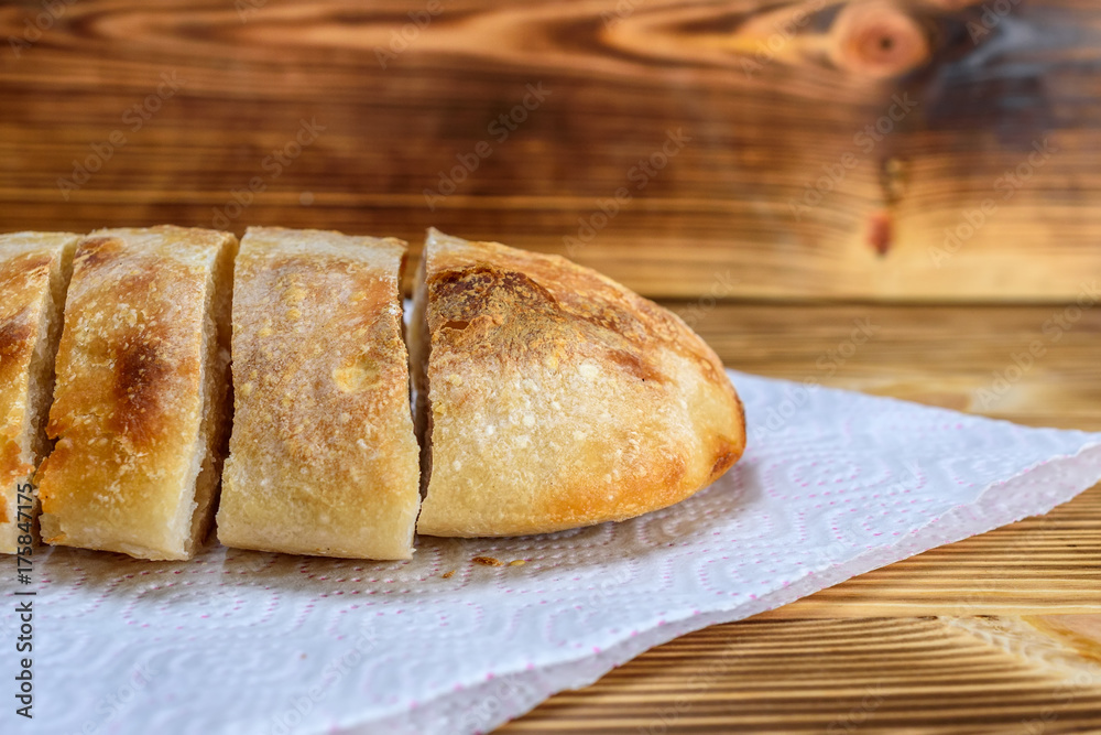 sliced homemade bread on a wooden background