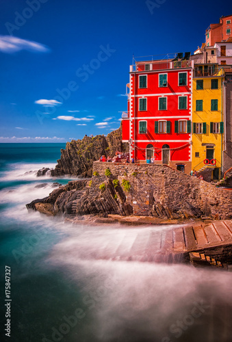 View of the colorful houses along the coastline of Cinque Terre area in Riomaggiore photo