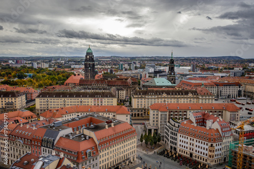 City view of Dresden in east Germany on a stormy autumn October day with the Steigenberger hotel in the foreground, the Kreuzkirch in the middle and the Freital area in the background. photo