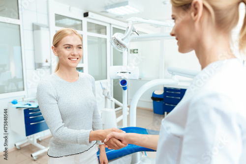 The woman came to the dental clinic. She communicates with a woman s dentist