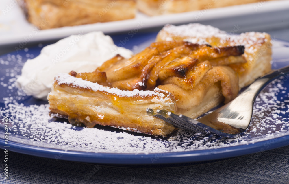 Rustic apple tart with an apricot glaze and powdered sugar Rustic apple tart with an apricot glaze and powdered sugar