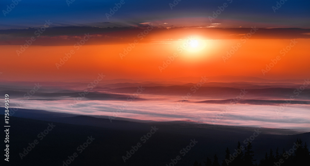 peaceful landscape with mountain range scenic view and morning fog on sunrise