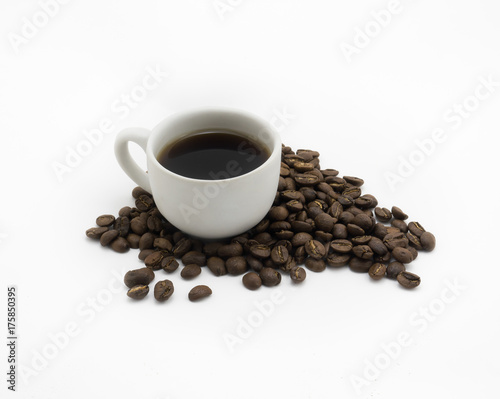 Isolated Cup of coffee and dark roasted coffee beans on white background