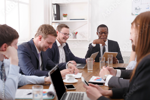 Business corporate meeting of young successful team with african american male boss.