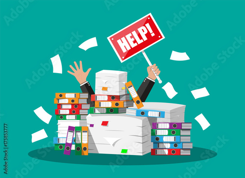 Businessman in pile of office papers