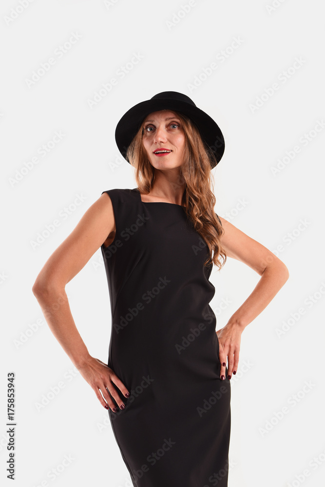 Cute woman dressed in formal style in black hat Cute woman dressed in formal style in black hat