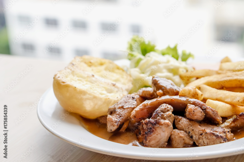 Pepper pork steak with French fried and salad Pepper pork steak with French fried and salad