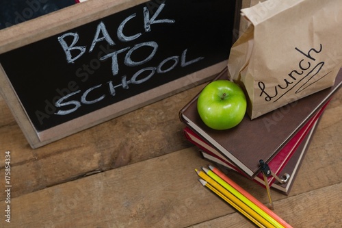 Lunch paper bag, green apple and slate with text back to school