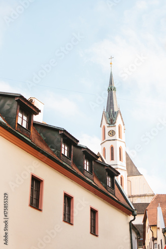 An interesting view of the St. Vitus Church and the house in Cesky Krumlov in the Czech Republic. The church is one of the main sights of the town.