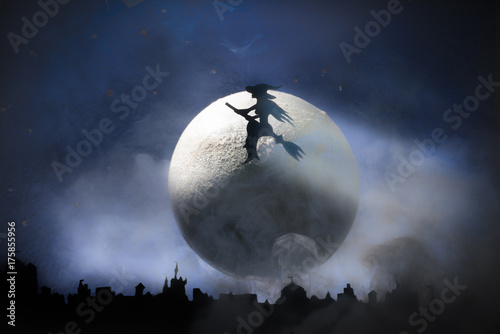  Halloween, witch on a broom, among the big moon