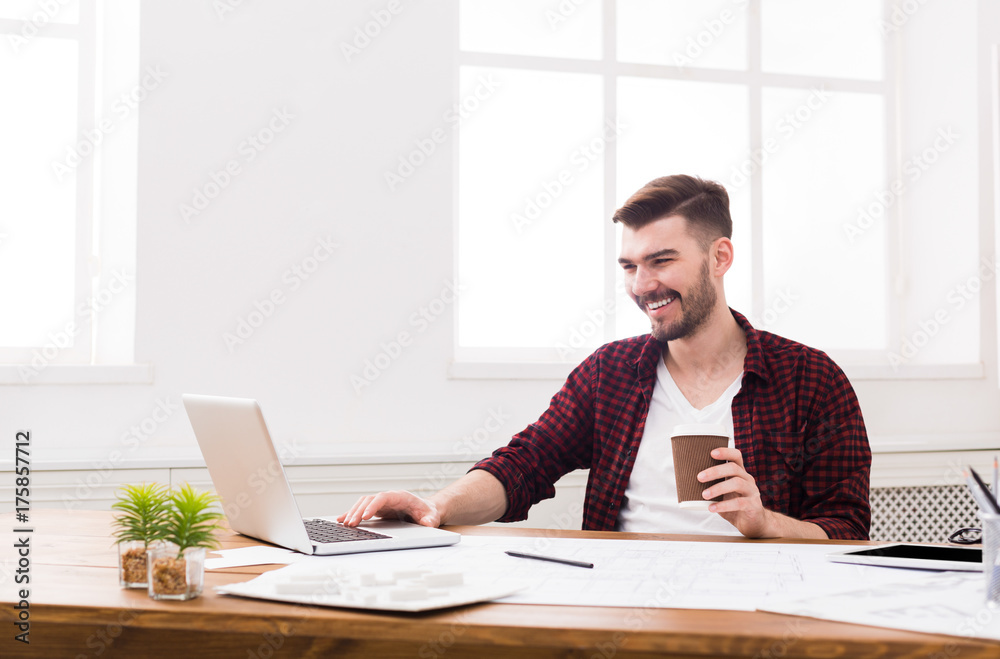 Young businessman working with laptop Young businessman working with laptop
