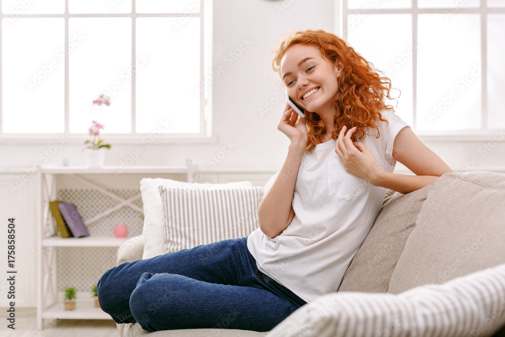 Smiling young girl calling on mobile phone Smiling young girl calling on mobile phone