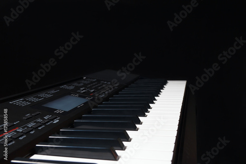 Electronic organ on a black background