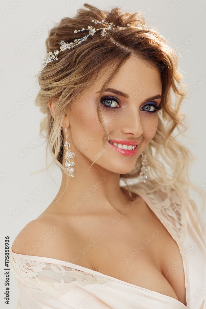Portrait of beautiful bride. Blonde girl with curly hair and fashion makeup.