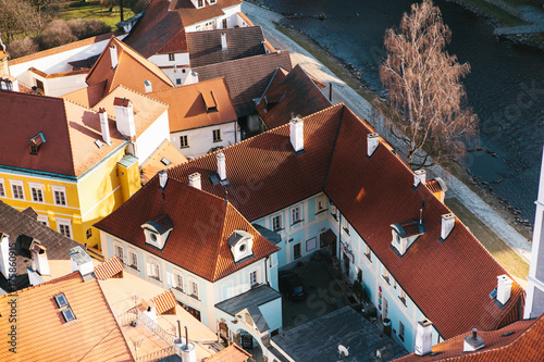Fototapeta Naklejka Na Ścianę i Meble -  A view from the air to beautiful authentic houses and streets in the town of Cesky Krumlov in the Czech Republic. One of the most beautiful small towns in the world. Europe.