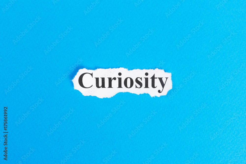 curiosity text on paper. Word curiosity on torn paper. Concept Image curiosity text on paper. Word curiosity on torn paper. Concept Image