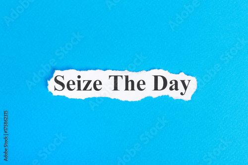 Seize The Day text on paper. Word Seize The Day on torn paper. Concept Image photo