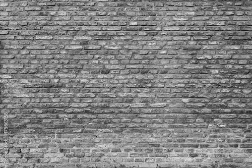 Old and aged brick wall texture background in black and white.