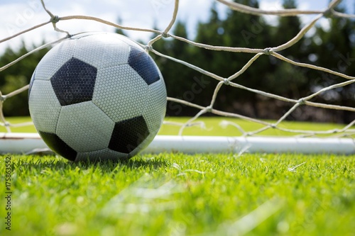 Close up of soccer ball in goal post © WavebreakMediaMicro