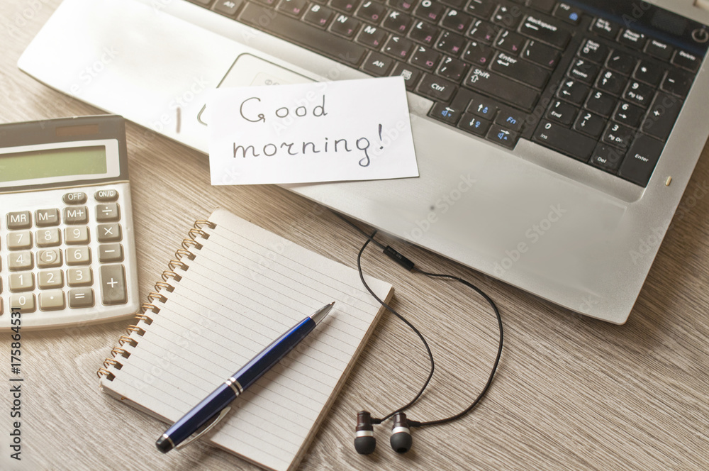 Computer, notebook and calculator on the desktop, the concept of education. The inscription with a good morning. Computer, notebook and calculator on the desktop, the concept of education. The inscription with a good morning.