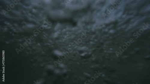 Waves on the ocean. The camera goes under water. Video recorded in slow motion. 
