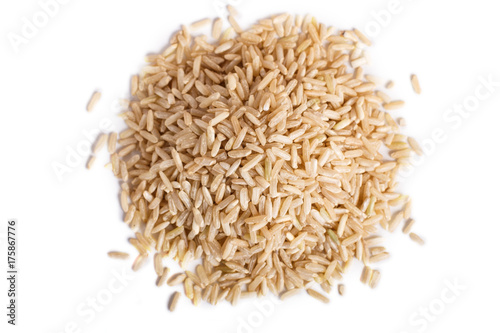 Pile of brown rice isolated on white background.