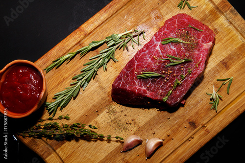 Raw beef on a cutting board.