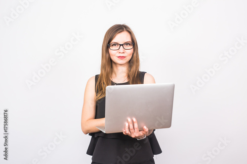 business, technology and people concept - businesswoman with laptop on white background