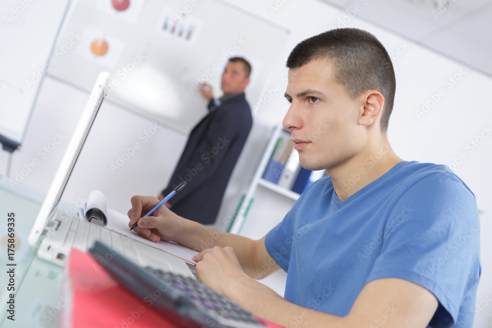 Fototapeta premium tutor near whiteboard screen giving lesson