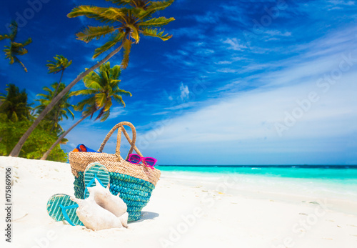 beach accessories on turquoise tropical background