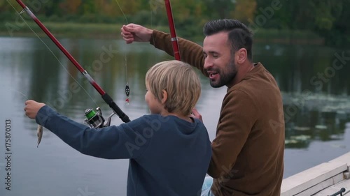 Father and son have fun on fishing. photo