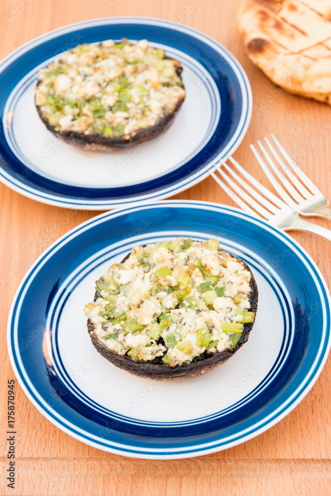 Grilled stuffed portobello mushrooms with feta cheese and scallions. Grilled stuffed portobello mushrooms with feta cheese and scallions.