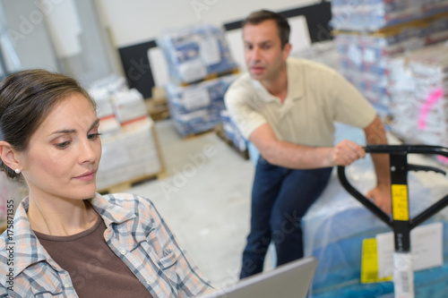 two workers in the warehouse