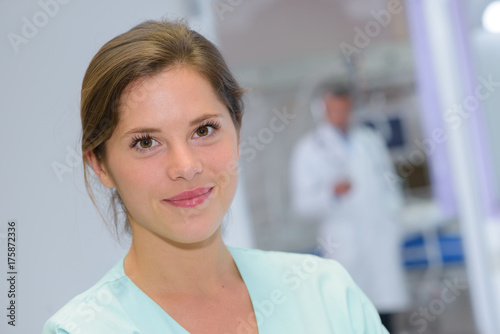 Free Download portrait of beautiful nurse looking at camera - GFXLoad