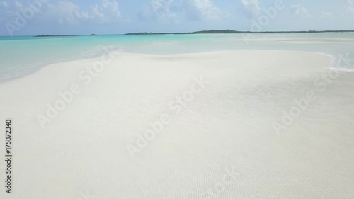 idyllic shore beach with cristall clear water and white sand photo