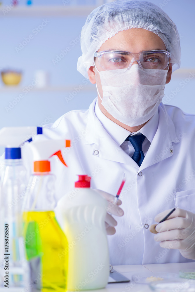 Man in the lab testing new cleaning solution detergent Man in the lab testing new cleaning solution detergent