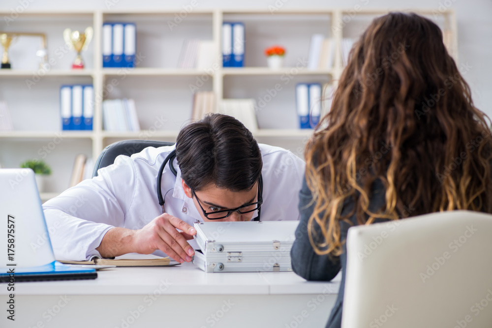 Young doctor in medical insurance fraud concept Young doctor in medical insurance fraud concept