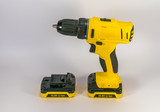 Yellow hand-held cordless screwdriver for professional work.