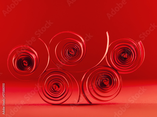 Macro, abstract, background picture of red paper spirals on paper background 