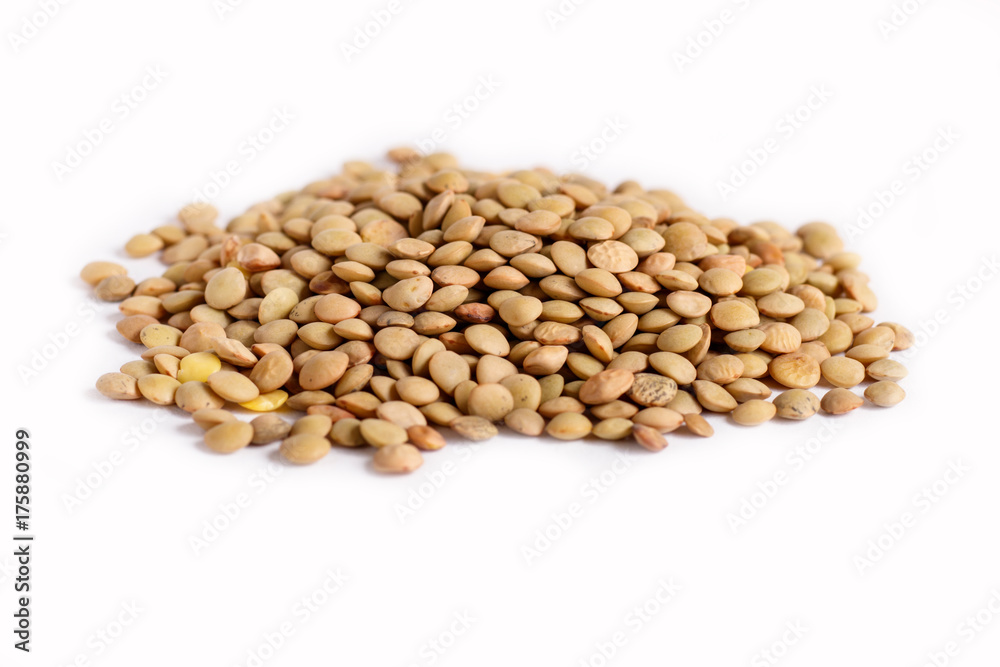 Pile of green lentils isolated on white background. Pile of green lentils isolated on white background.
