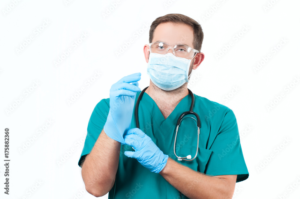 Male Doctor with stethoscope and protective mask and gloves. Male Doctor with stethoscope and protective mask and gloves.
