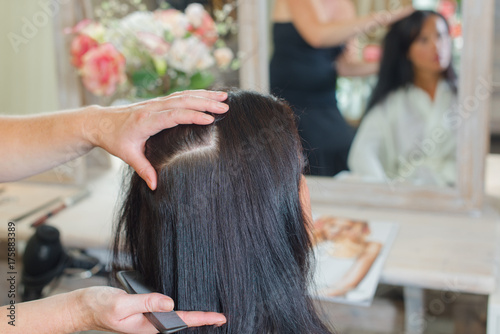 Styling a woman's hair in the salon