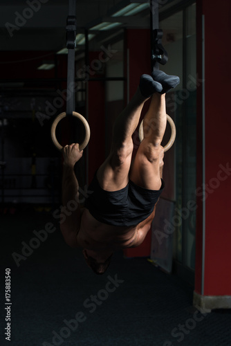 Muscular Man Hold Gymnastic Rings